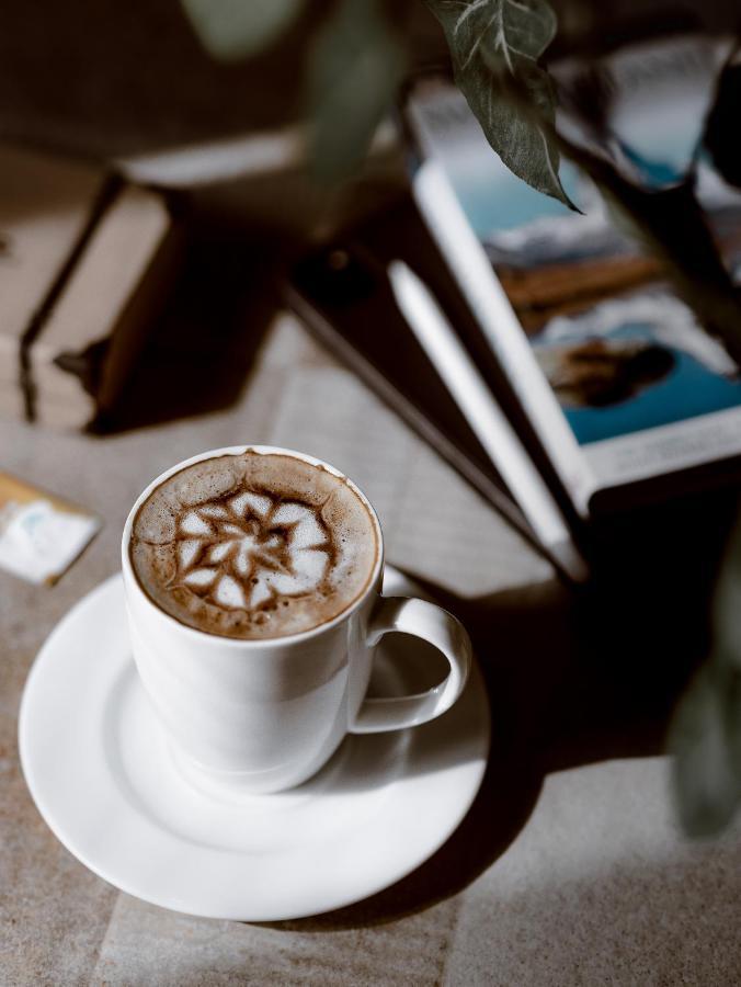 全景逍遥酒店 蒙纳 外观 照片 A cup of coffee